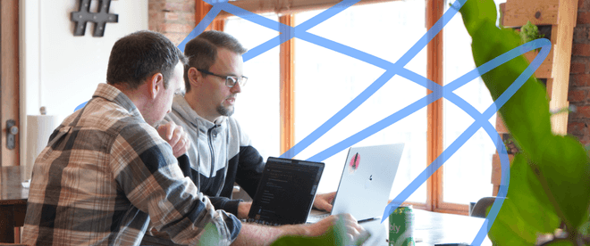 Sam Otis and Ryan Blackwell sitting at a table.