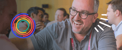 A stylized photo of person laughing with an Entrepreneurs Organization logo.