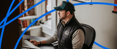Corey Vilhauer sitting at his desk.