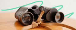 Binoculars sitting on a table.