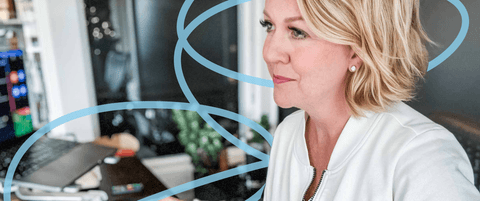 Karla Santi sitting at her desk.