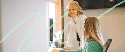 Karla Santi speaking with a Blend employee.