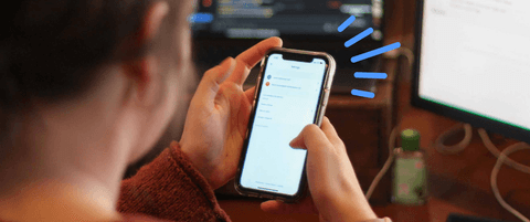 Someone looking at a mobile device.