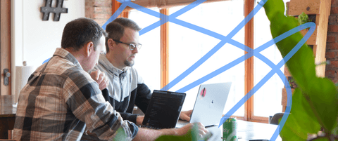 Sam Otis and Ryan Blackwell sitting at a table.