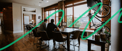 Two people sitting at Blend's dining room tables.