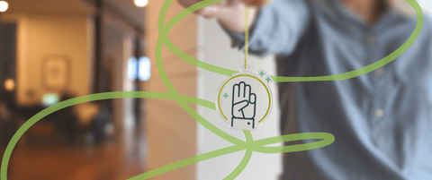 Someone holding a token of Blend's "Integrity" award.